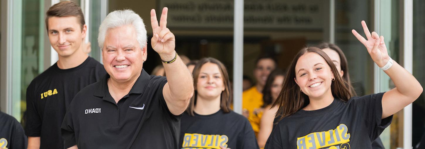 President Green walking around campus with students